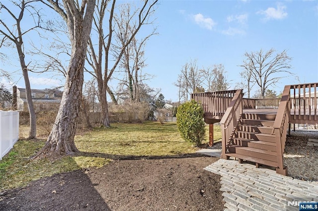 view of yard with a wooden deck