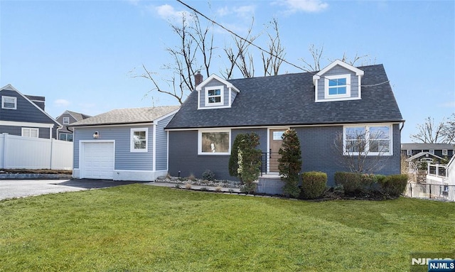 cape cod-style house with a garage and a front lawn