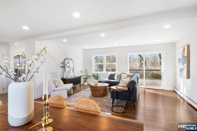 living room featuring a baseboard radiator and hardwood / wood-style floors