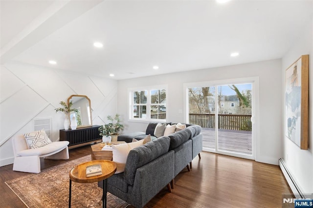 living room featuring a baseboard radiator and dark hardwood / wood-style floors