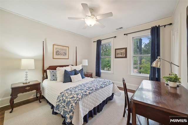 bedroom with ceiling fan and light wood-type flooring