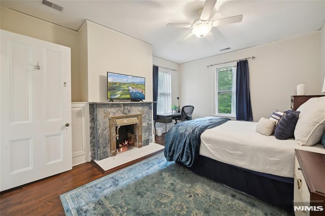 bedroom featuring ceiling fan and dark hardwood / wood-style flooring