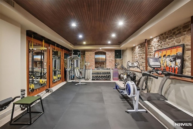 exercise room featuring wood ceiling