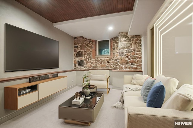 carpeted home theater featuring wooden ceiling