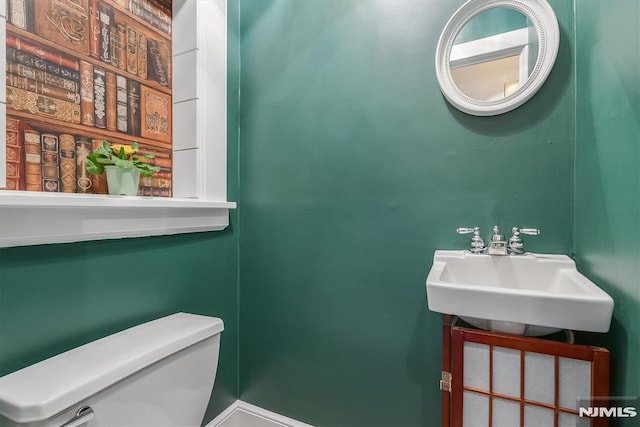 bathroom with sink and toilet