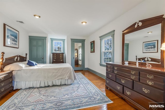 bedroom featuring a closet and light hardwood / wood-style flooring