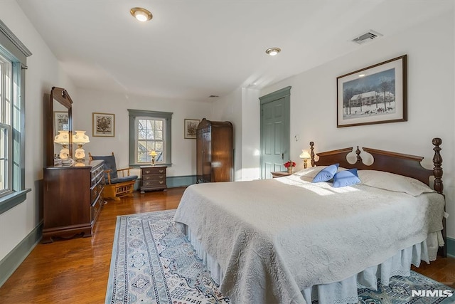 bedroom with hardwood / wood-style floors