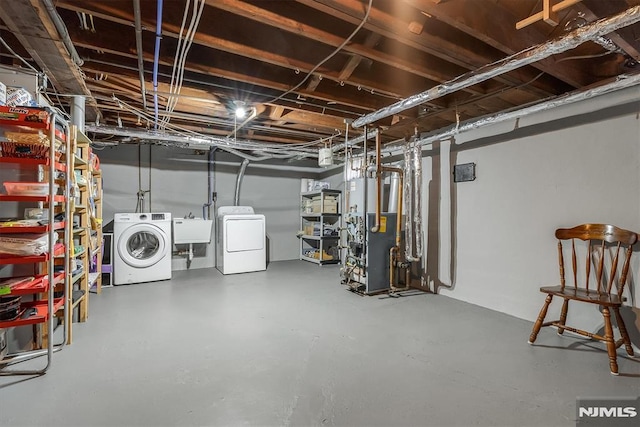 basement with sink and separate washer and dryer