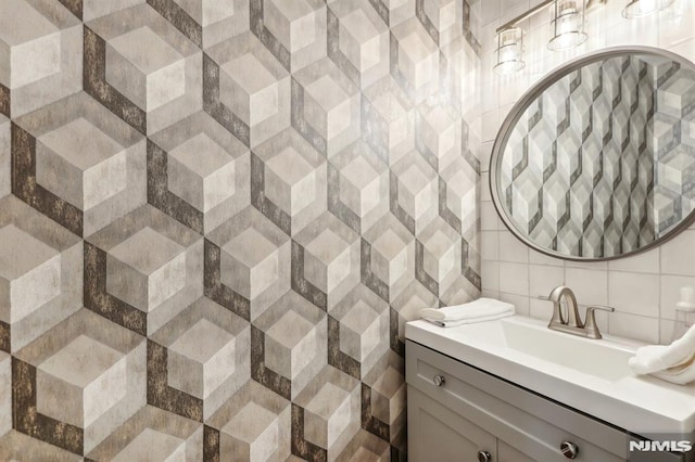 bathroom with vanity and decorative backsplash