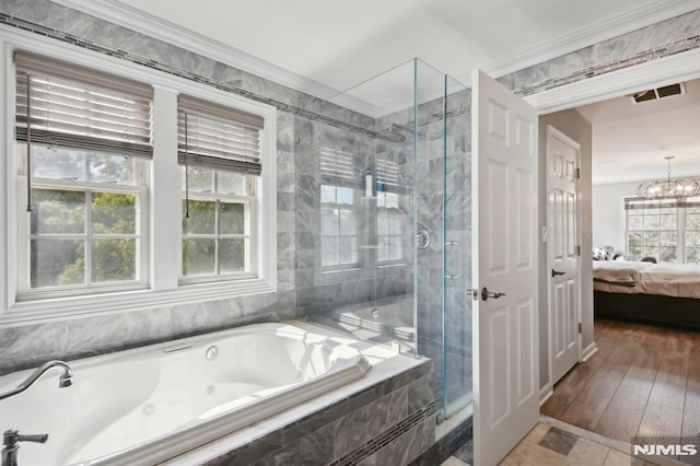 bathroom featuring ornamental molding, shower with separate bathtub, wood-type flooring, and a chandelier