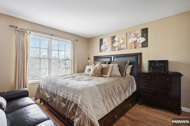 bedroom with hardwood / wood-style floors