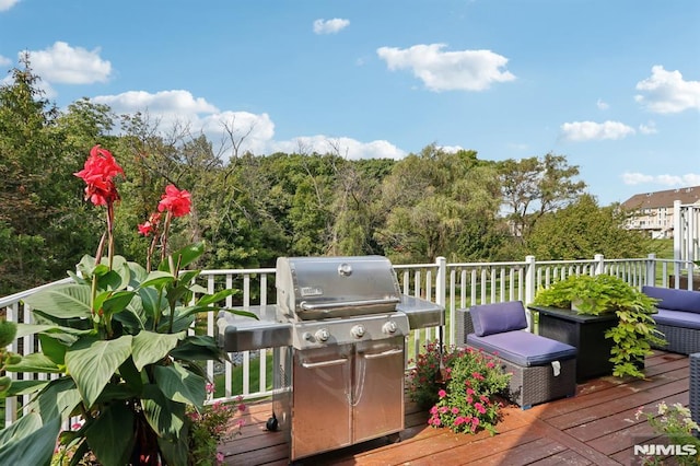 wooden deck with grilling area