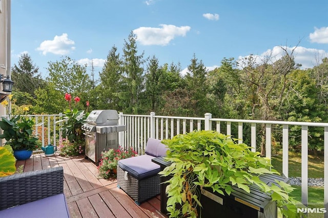 wooden deck featuring grilling area