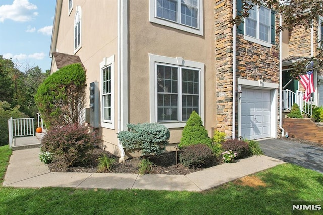 view of property exterior featuring a garage