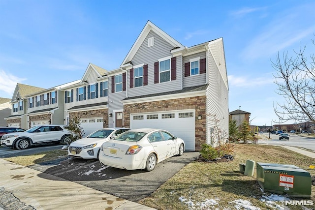 multi unit property featuring a garage