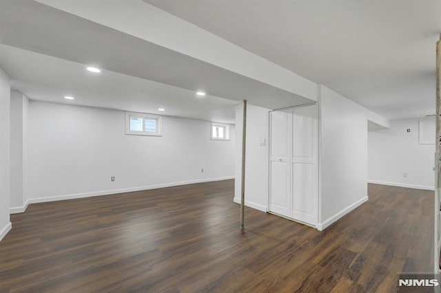 basement with dark wood-type flooring