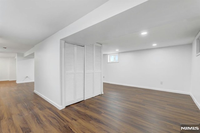 basement with dark wood-type flooring