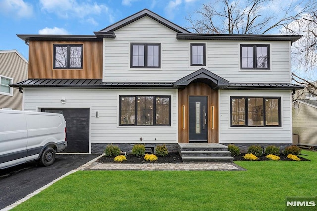 modern farmhouse with a garage and a front yard