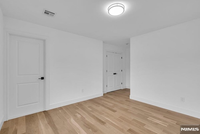 unfurnished room featuring light wood-type flooring