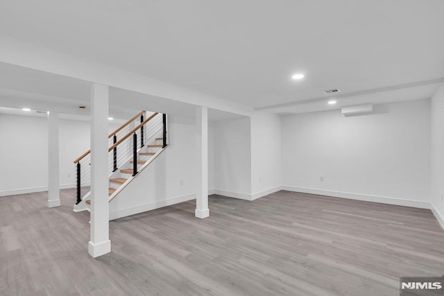 basement featuring light wood-type flooring