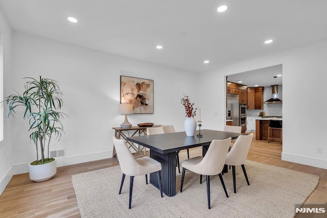 dining space featuring light hardwood / wood-style floors