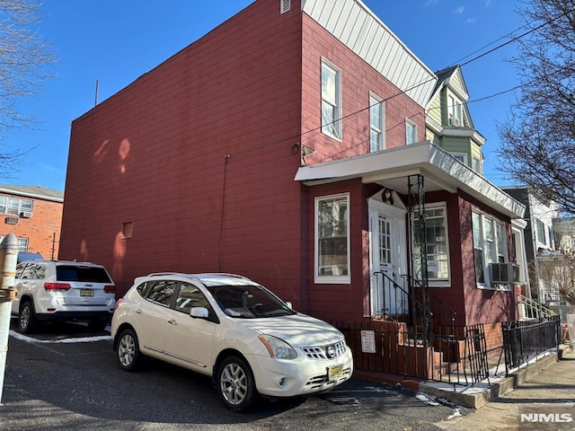 view of property exterior with cooling unit