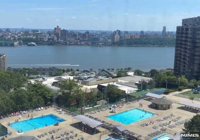 birds eye view of property with a water view