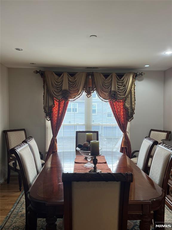 dining area with hardwood / wood-style flooring