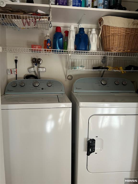 washroom featuring washer and dryer