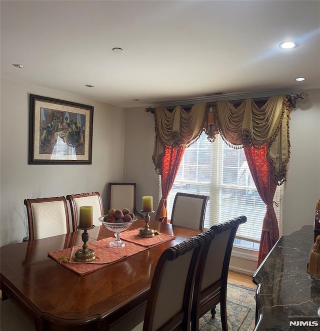 dining area featuring hardwood / wood-style floors