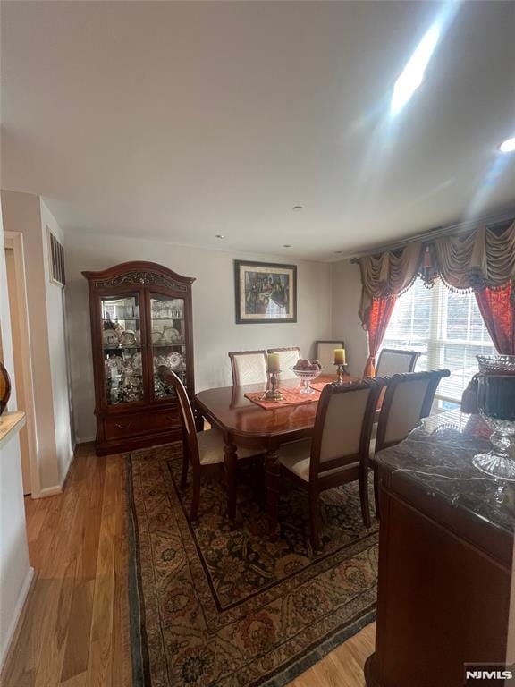 dining room with hardwood / wood-style floors