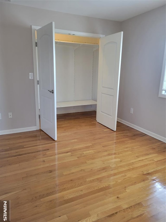 unfurnished bedroom featuring light wood-type flooring