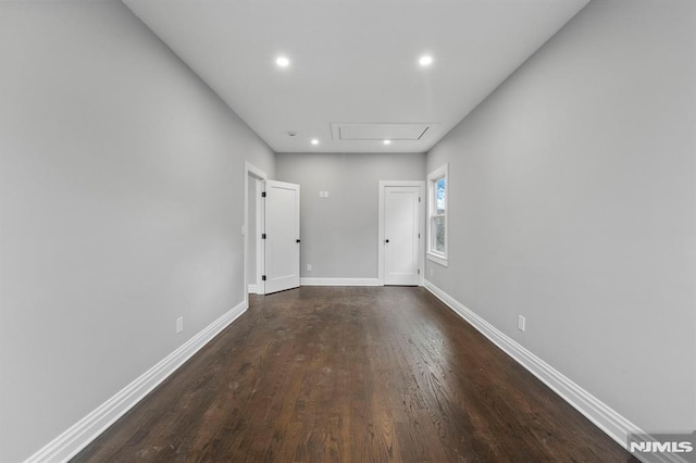 spare room featuring dark hardwood / wood-style floors