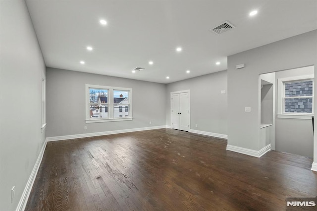 spare room featuring dark hardwood / wood-style flooring