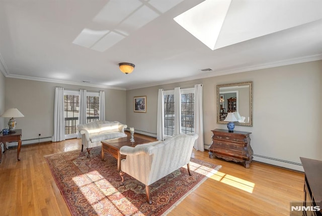 living room featuring crown molding, a baseboard radiator, light hardwood / wood-style flooring, and a skylight