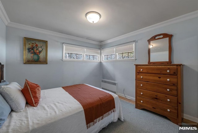 bedroom featuring ornamental molding and radiator