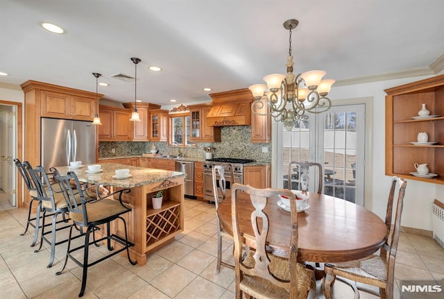 dining space featuring radiator heating unit, an inviting chandelier, light tile patterned floors, and crown molding