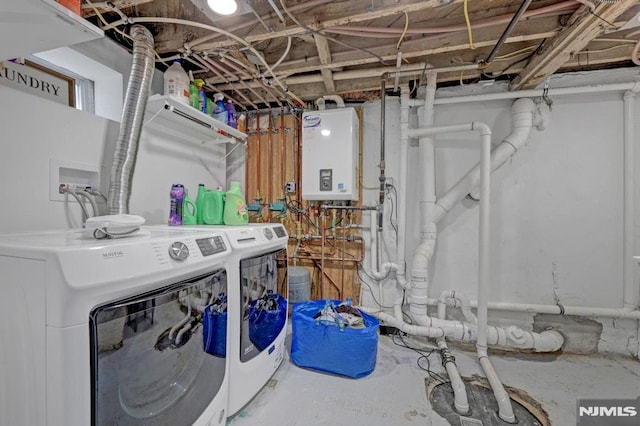 laundry room featuring washing machine and dryer and water heater