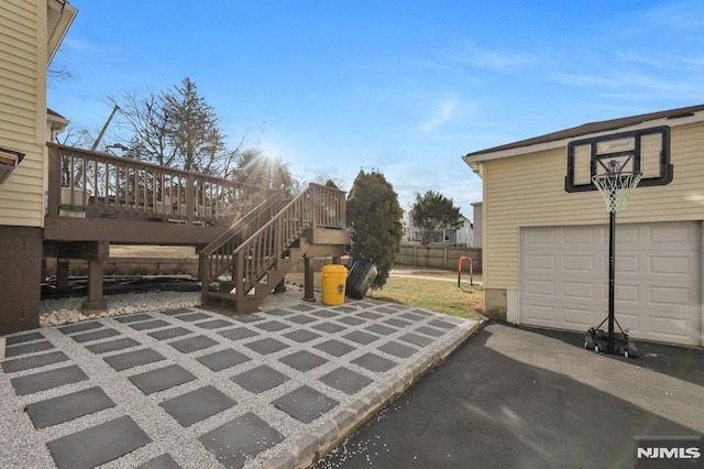 view of patio / terrace featuring a garage and a deck