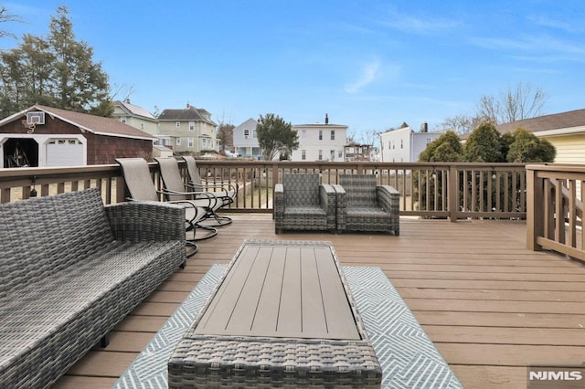 wooden deck featuring outdoor lounge area