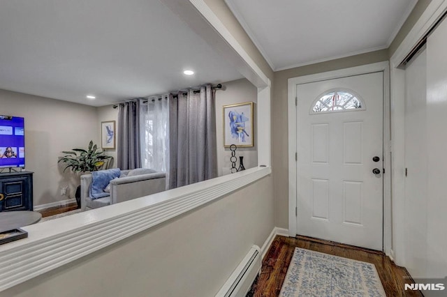 foyer entrance featuring dark hardwood / wood-style floors and crown molding