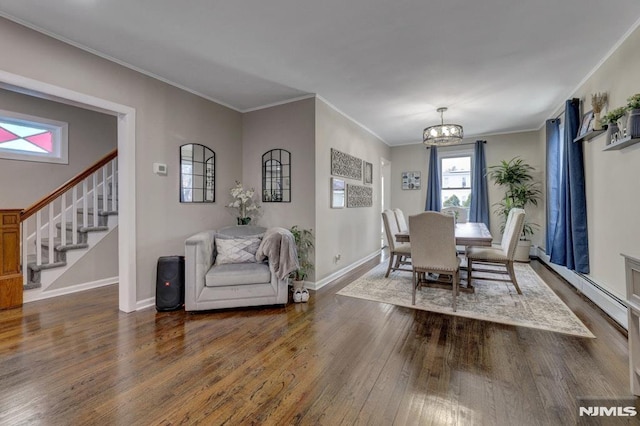 dining room with a chandelier, crown molding, and dark wood-type flooring