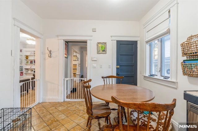 dining room featuring built in shelves