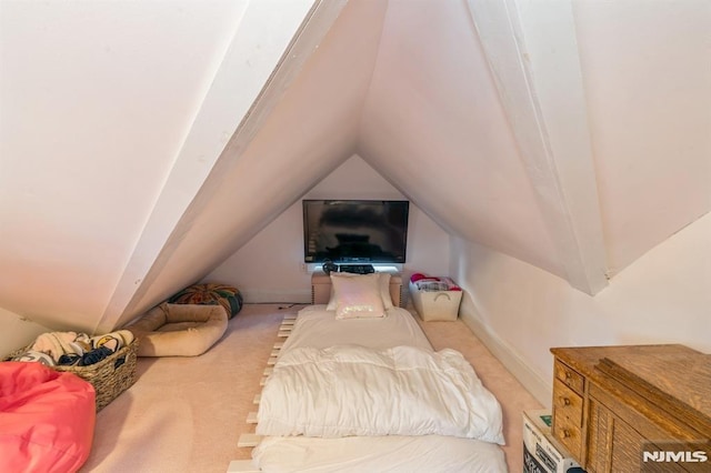 cinema with light carpet and vaulted ceiling