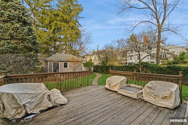 deck with an outbuilding