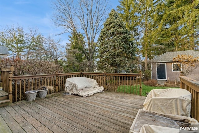 wooden deck with an outdoor structure