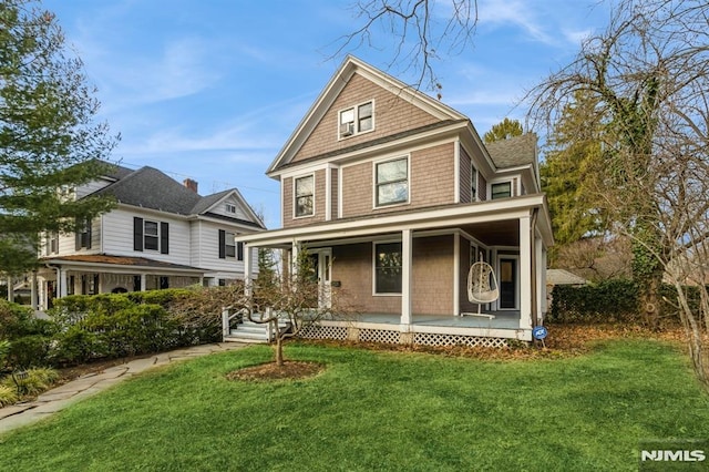 view of front facade featuring a porch and a front yard