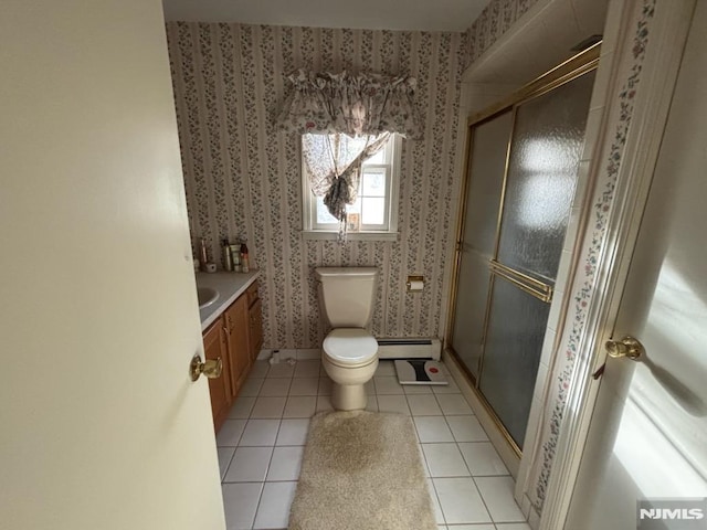 bathroom featuring walk in shower, vanity, a baseboard radiator, tile patterned flooring, and toilet