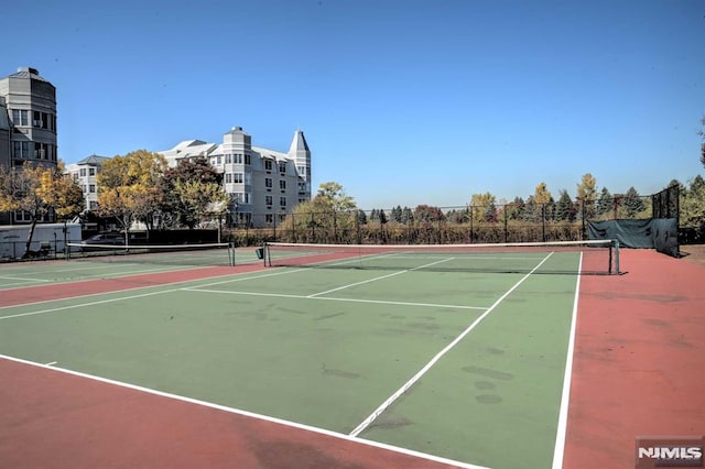 view of sport court with basketball hoop