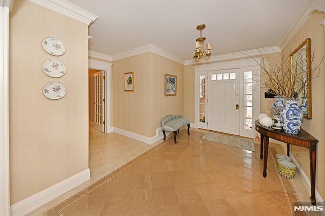 entrance foyer featuring crown molding and a chandelier